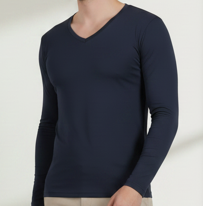 Person wearing a navy t-shirt and beige pants against a neutral background