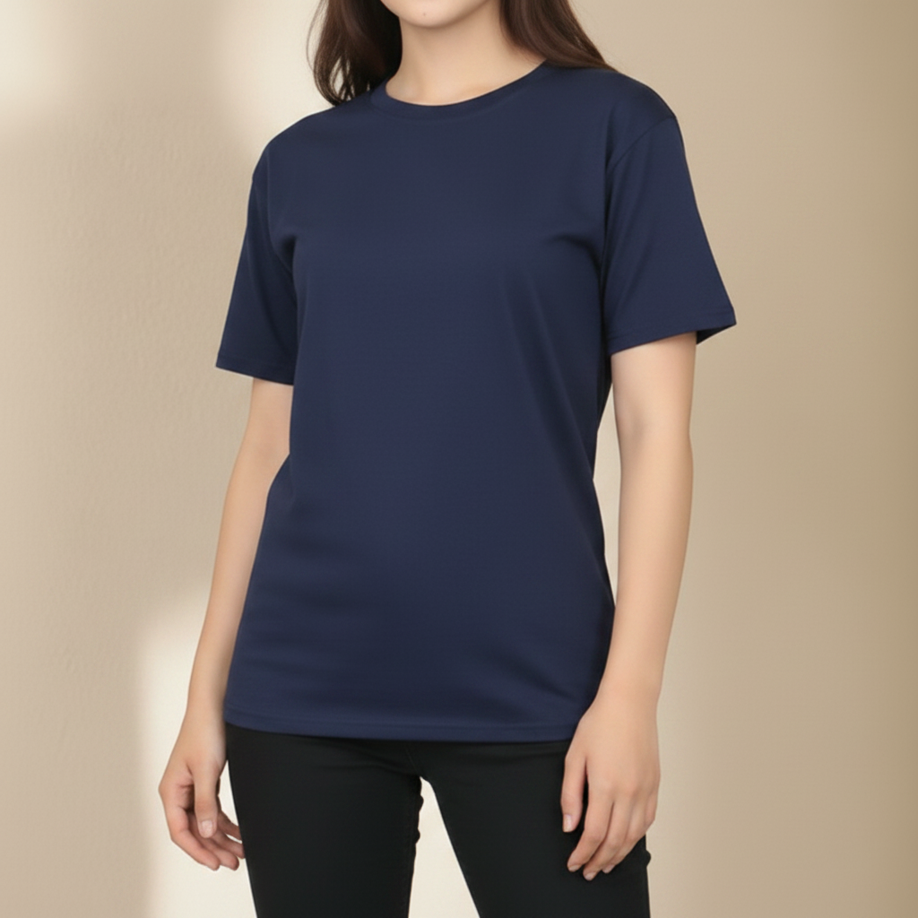 Person wearing a plain navy t-shirt against a beige background