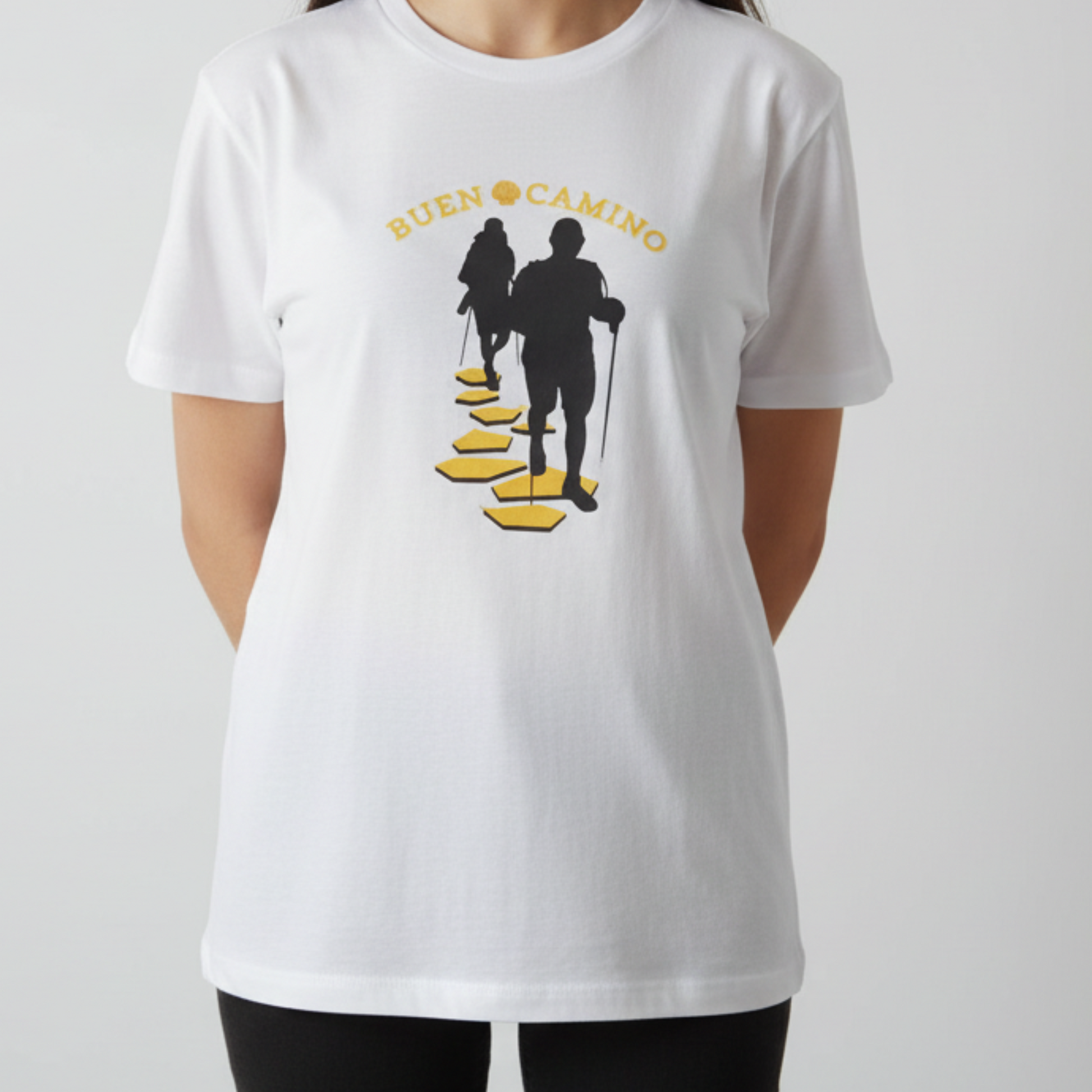 White t-shirt with black and yellow graphic design on a plain background