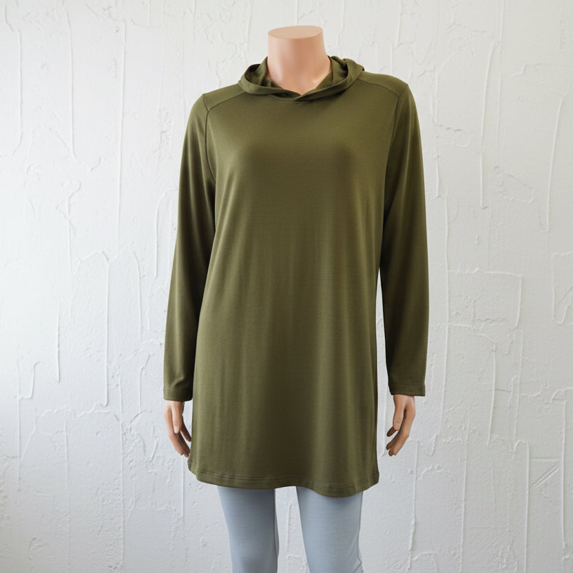 Light green long-sleeve top and leggings on a mannequin against a plain background