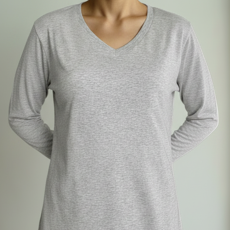 Person wearing a gray t-shirt against a plain background