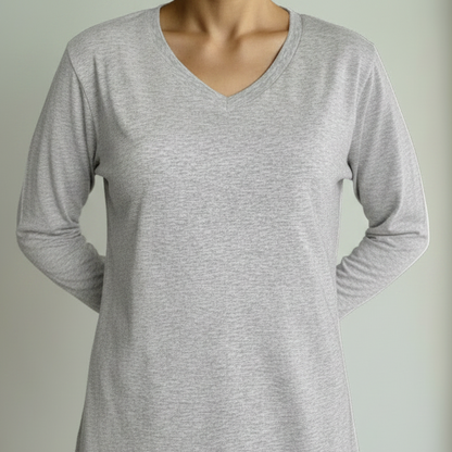 Person wearing a gray t-shirt against a plain background