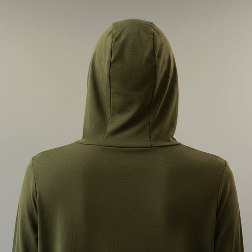Person wearing a green hoodie against a plain background